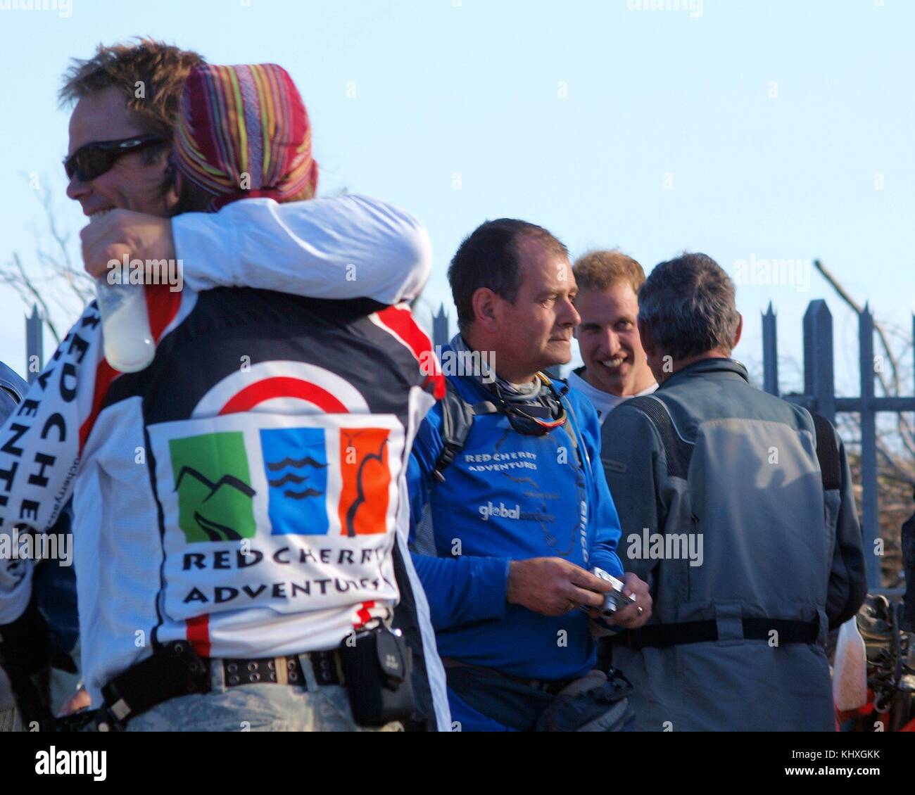 PORT EDWARD, SOUTH AFRICA - OCTOBER 24:  Prince William and Harry photographed at the Summerstrand Hotel in Port Elizabeth this afternoon. The princes have been on an 8 day Enduro Africa 08 Event through South Africa’s Eastern Cape. A bomb squad searched and secured the hotel before the princes and the other bikers arrived. All the bikers were accompanied by police vehicles with sirens turned on. The party was offered cold Smirnoff Spins to drink  by hotel staff after their long ride today. Team photographs were taken and the princes were then individually accompanied at a jog to the entrance  Stock Photo