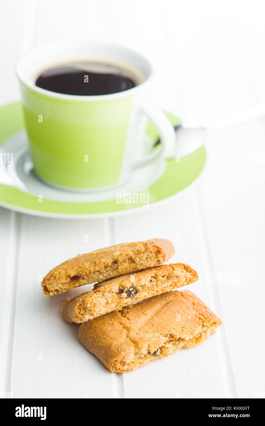 Sweet cookies and coffee cup on white table. Stock Photo