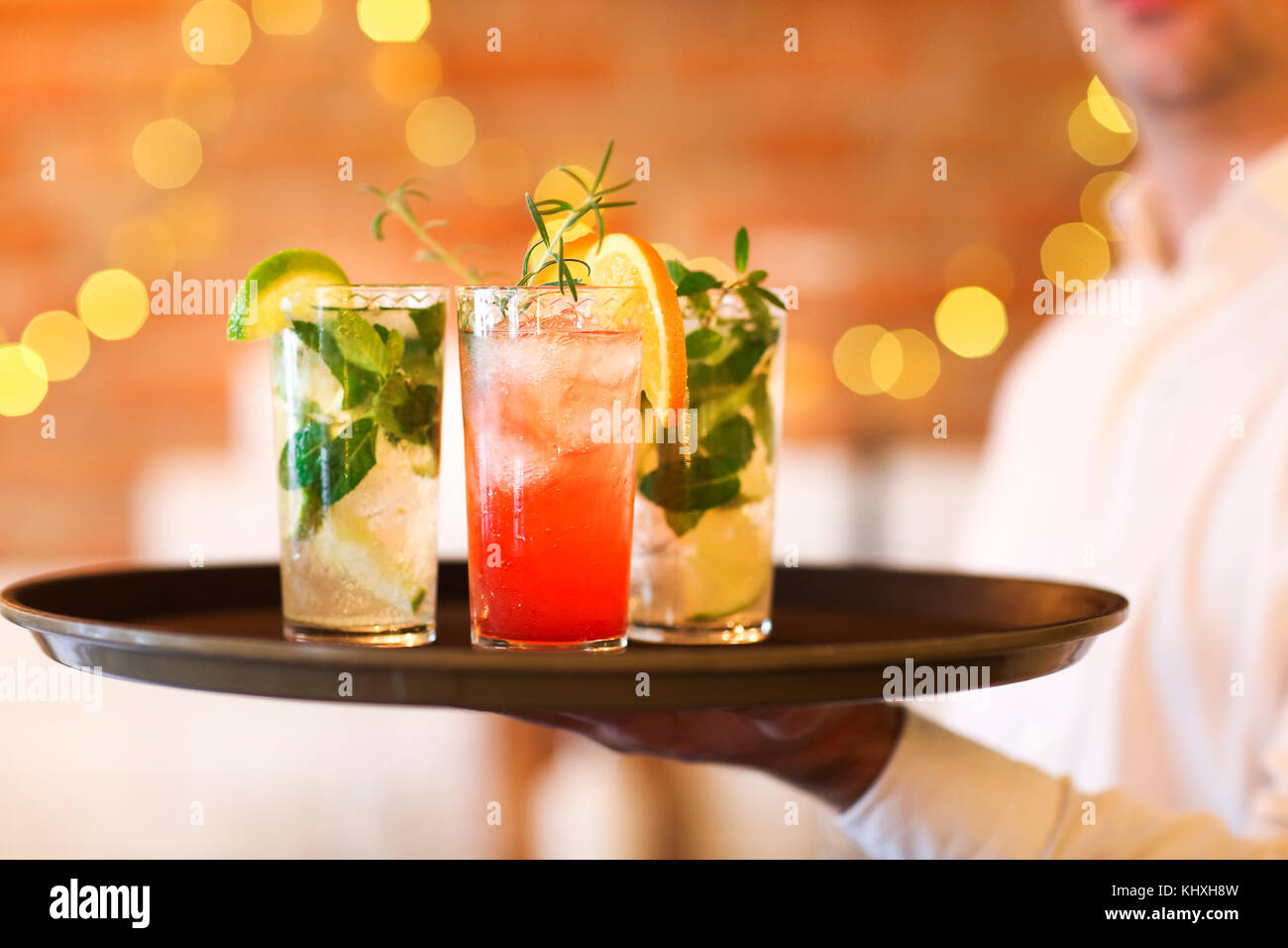Glasses alcohol cocktail set on a waiter tray in bar. AI Generated 32491021  Stock Photo at Vecteezy