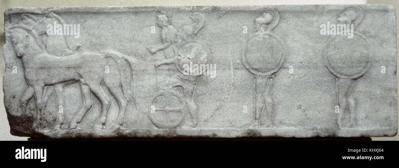 Greek Art. Base of funerary Kouros. Four-horse chariot and hoplites. 510-500 BC. Relief. Found in the Kerameikos, built into the Themistokleian wall. National Archaeological Museum of Athens, Stock Photo