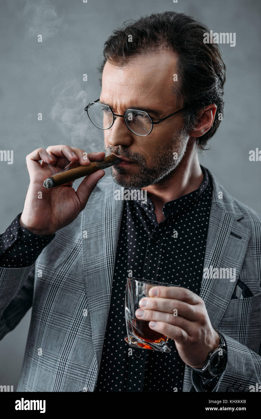 businessman smoking cigar Stock Photo Alamy