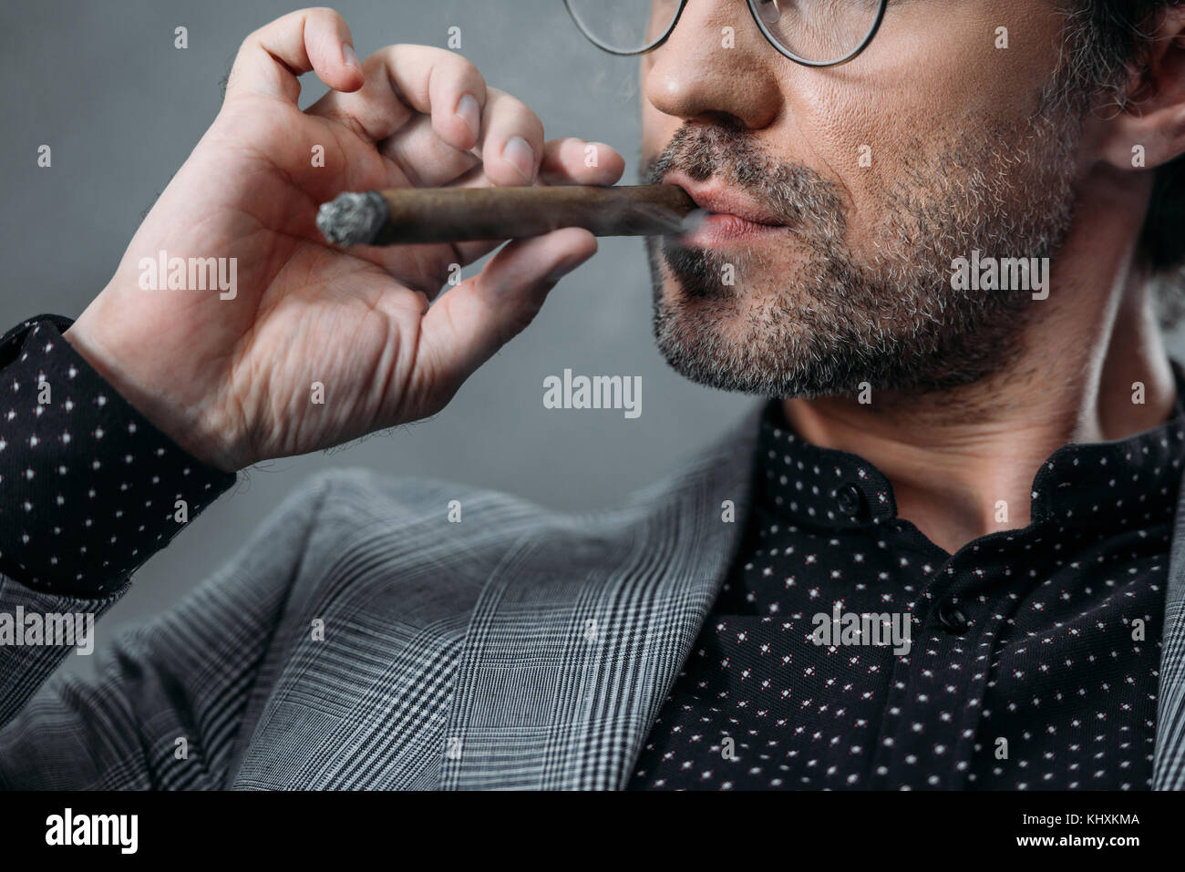 businessman smoking cigar Stock Photo Alamy