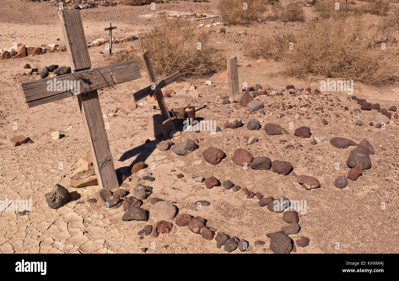 Several graves from a cemetery in the Mojave Desert in California Stock Photo