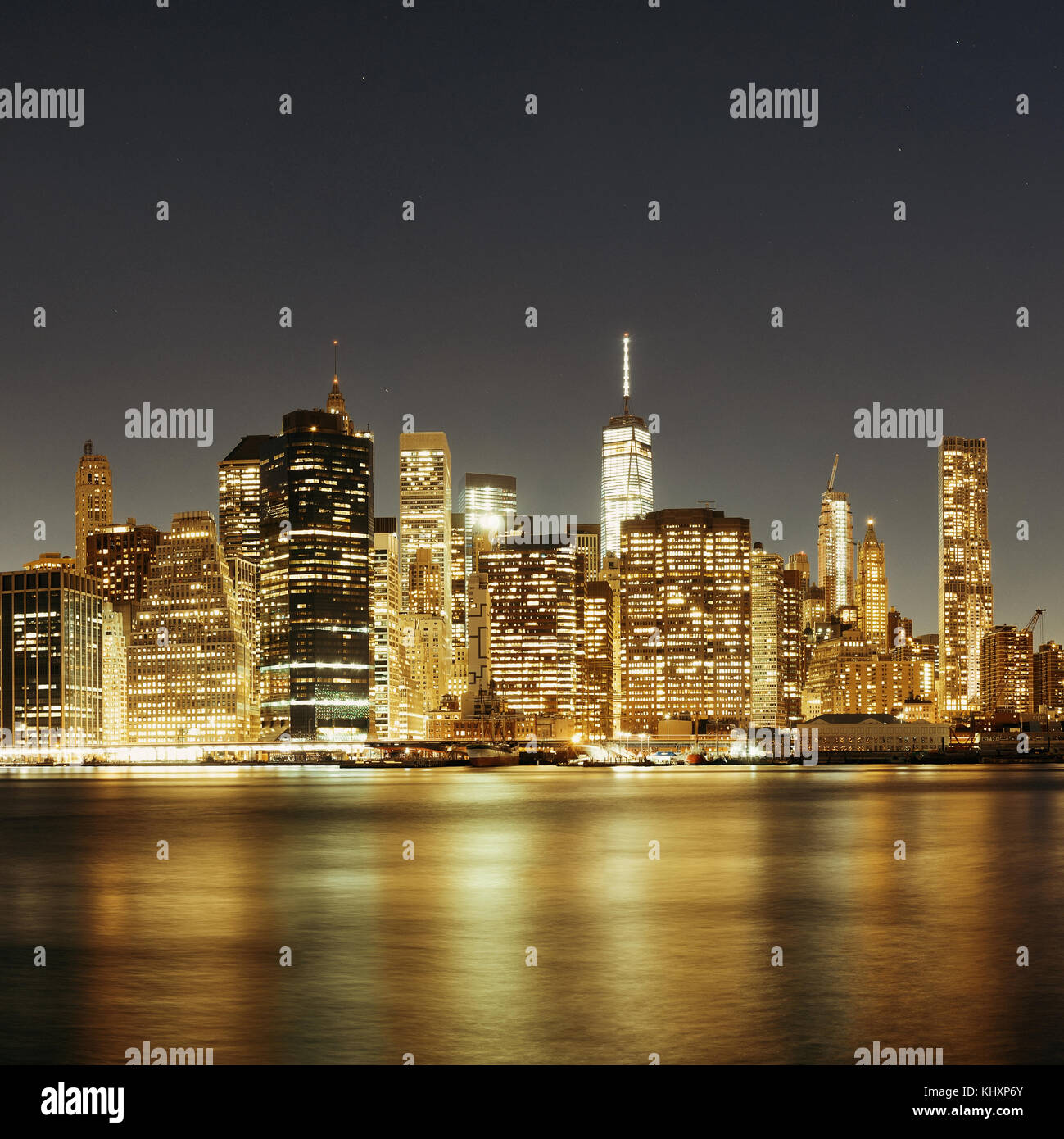 Downtown Manhattan skyline over East River at night in New York City ...