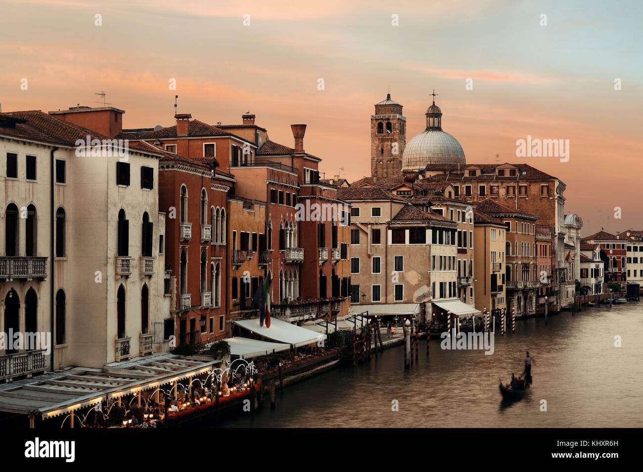 Venice grand canal sunset view with Gondola and historical buildings ...