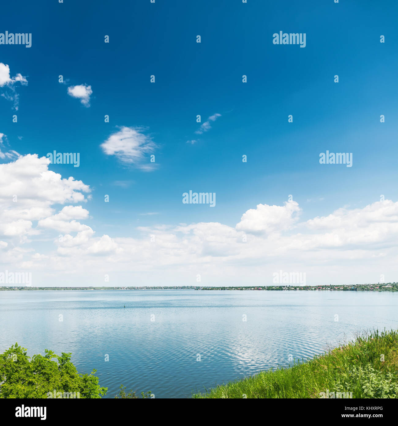 blue sky with clouds and reflections of it in river Stock Photo - Alamy