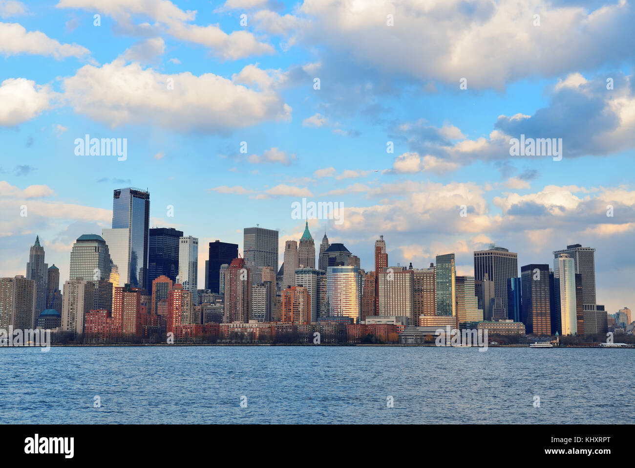 Downtown Manhattan skyline at sunset over Hudson River in New York City ...