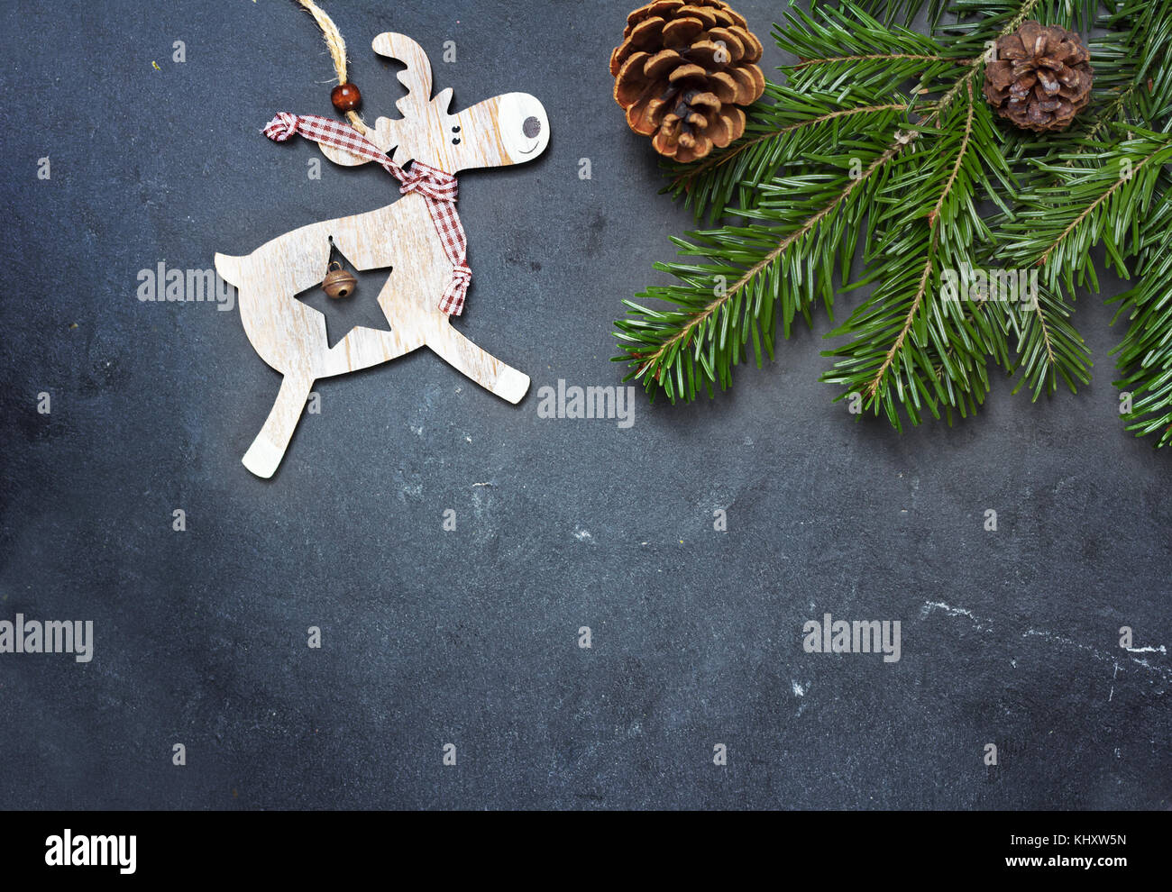 christmas decorations and fir tree branch on dark table. Top view with copy space Stock Photo