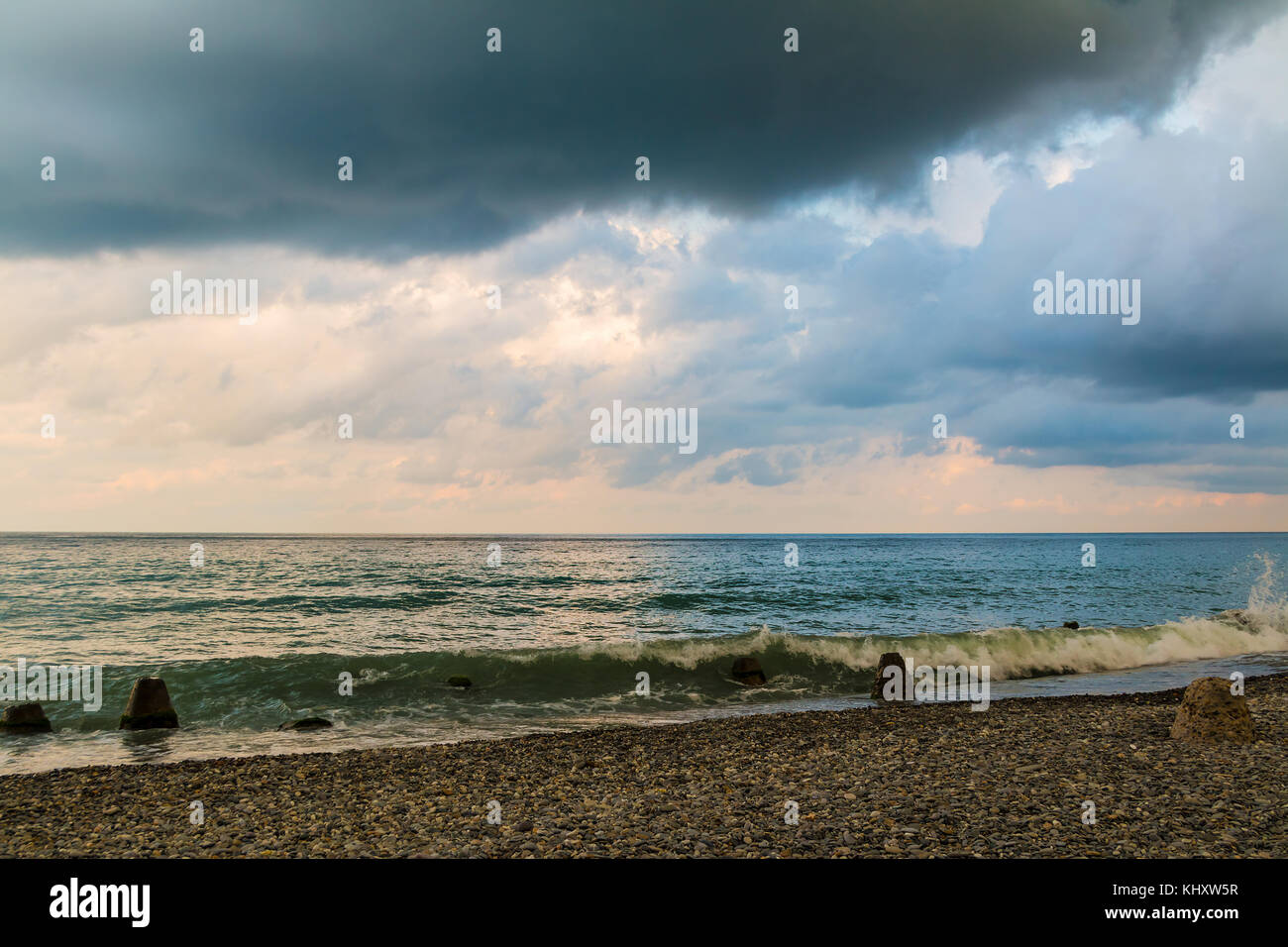 Seascape with the sea surf, water of different colors and contrasting clouds Stock Photo