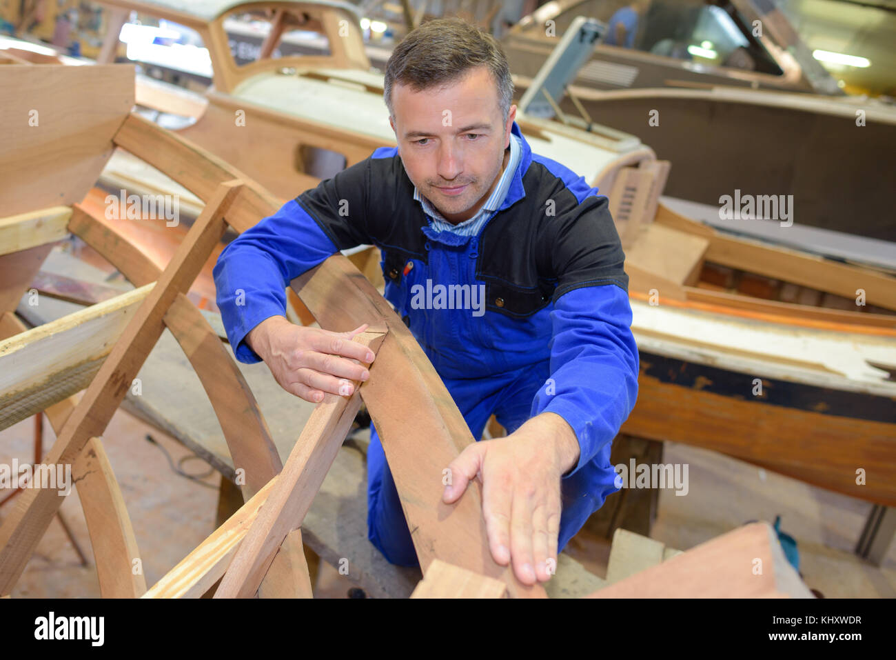 boat maker touching wooden surface Stock Photo Alamy