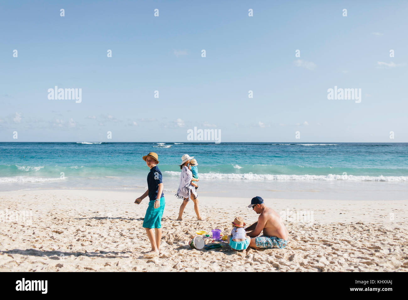 Family on beach together Stock Photo