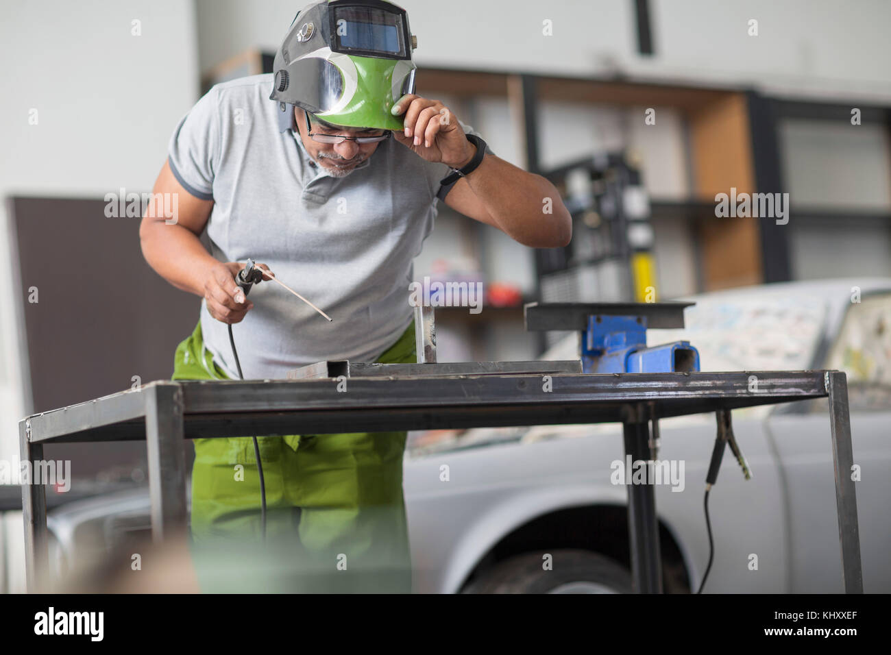 Man welding in bodywork repair shop Stock Photo Alamy