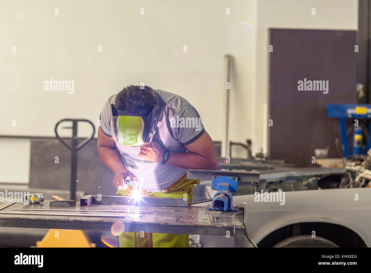 Man welding in bodywork repair shop Stock Photo Alamy