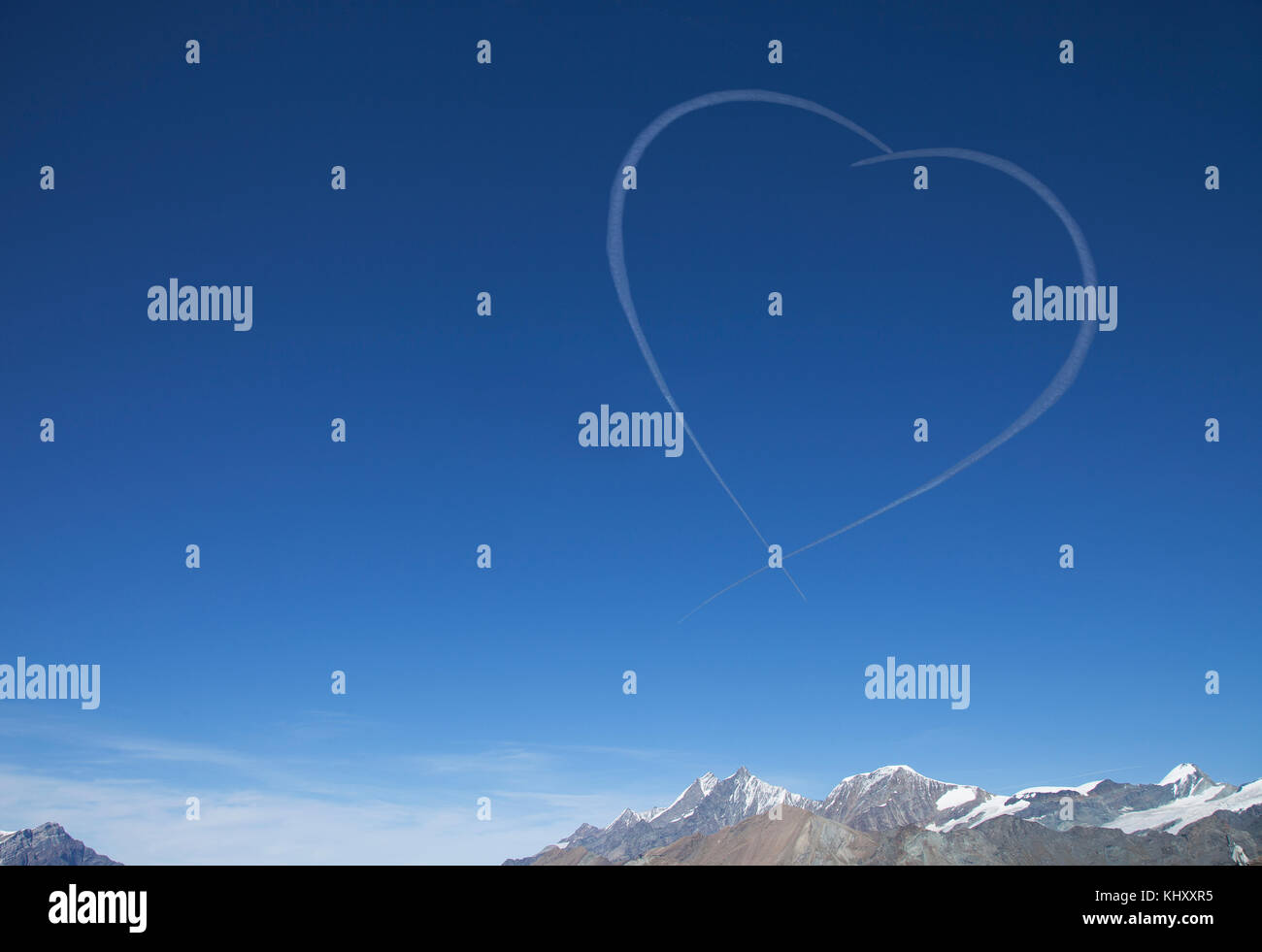 Scenic view of snowcapped mountains, heart shape in sky, Zermatt, Valais, Switzerland, Europe Stock Photo