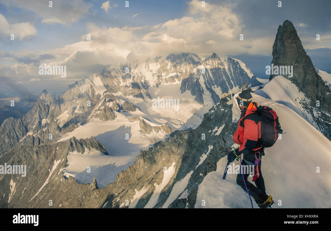 Mountain climber on the Rochefort Ridge looking at Mont Blanc, Courmayeur, Aosta Valley, Italy, Europe Stock Photo