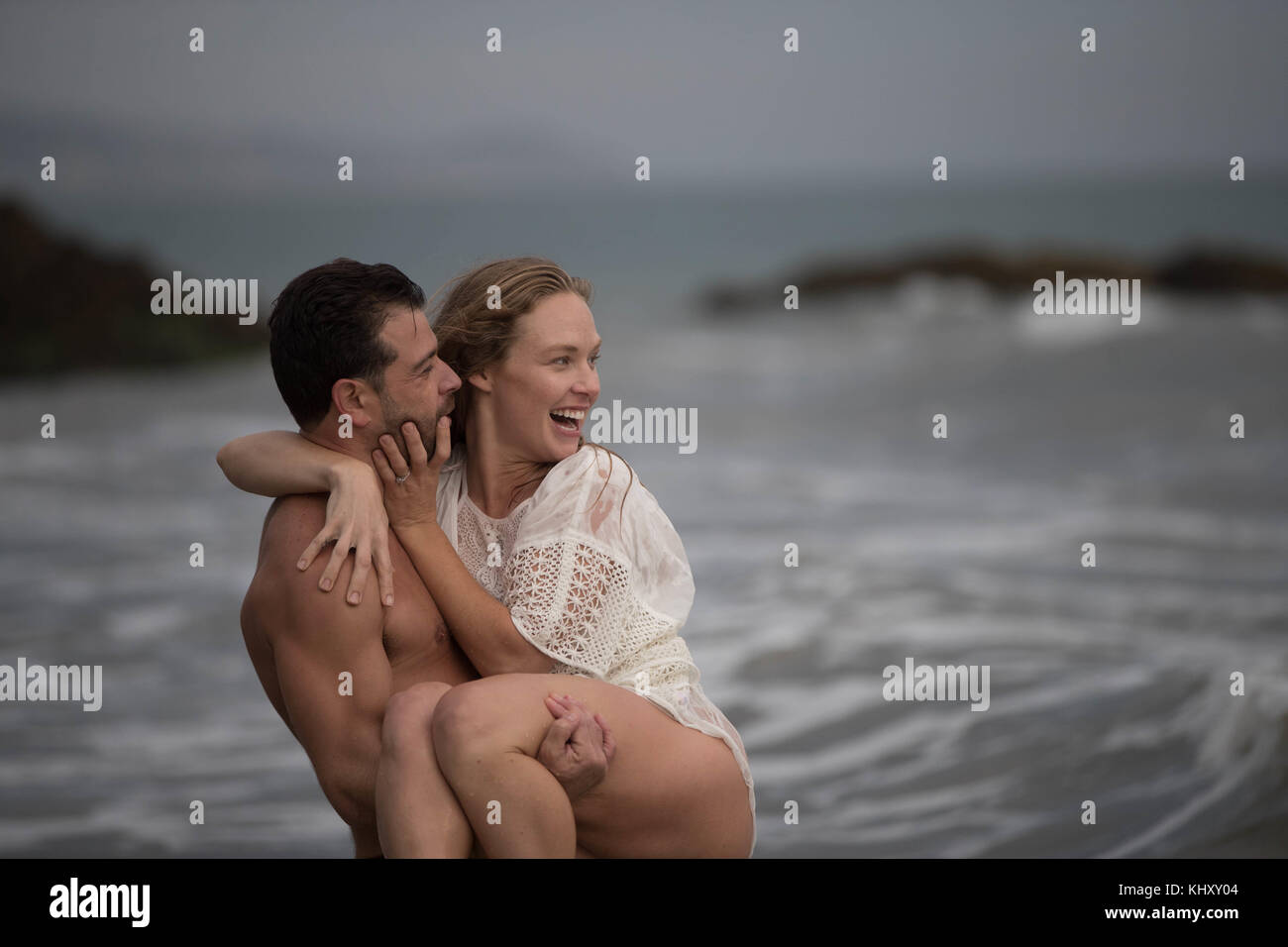 Romantic couple on beach, Malibu, California, US Stock Photo