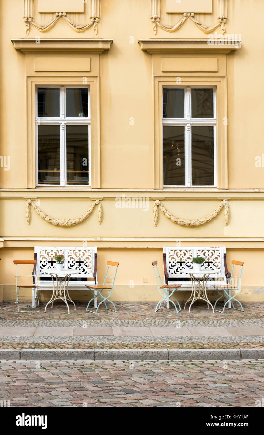 bistro cafe tables on the street of potsdam in germany Stock Photo