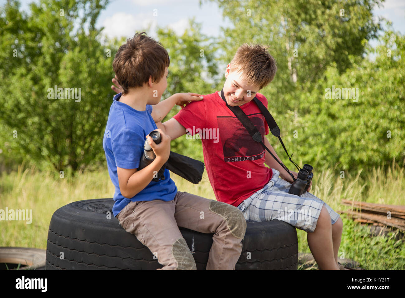 Brothers having fun whilst posing. Boys portrait, young little cute and adorable kids, little obstreperous scamps. Poses, face expressions, ease. Stock Photo