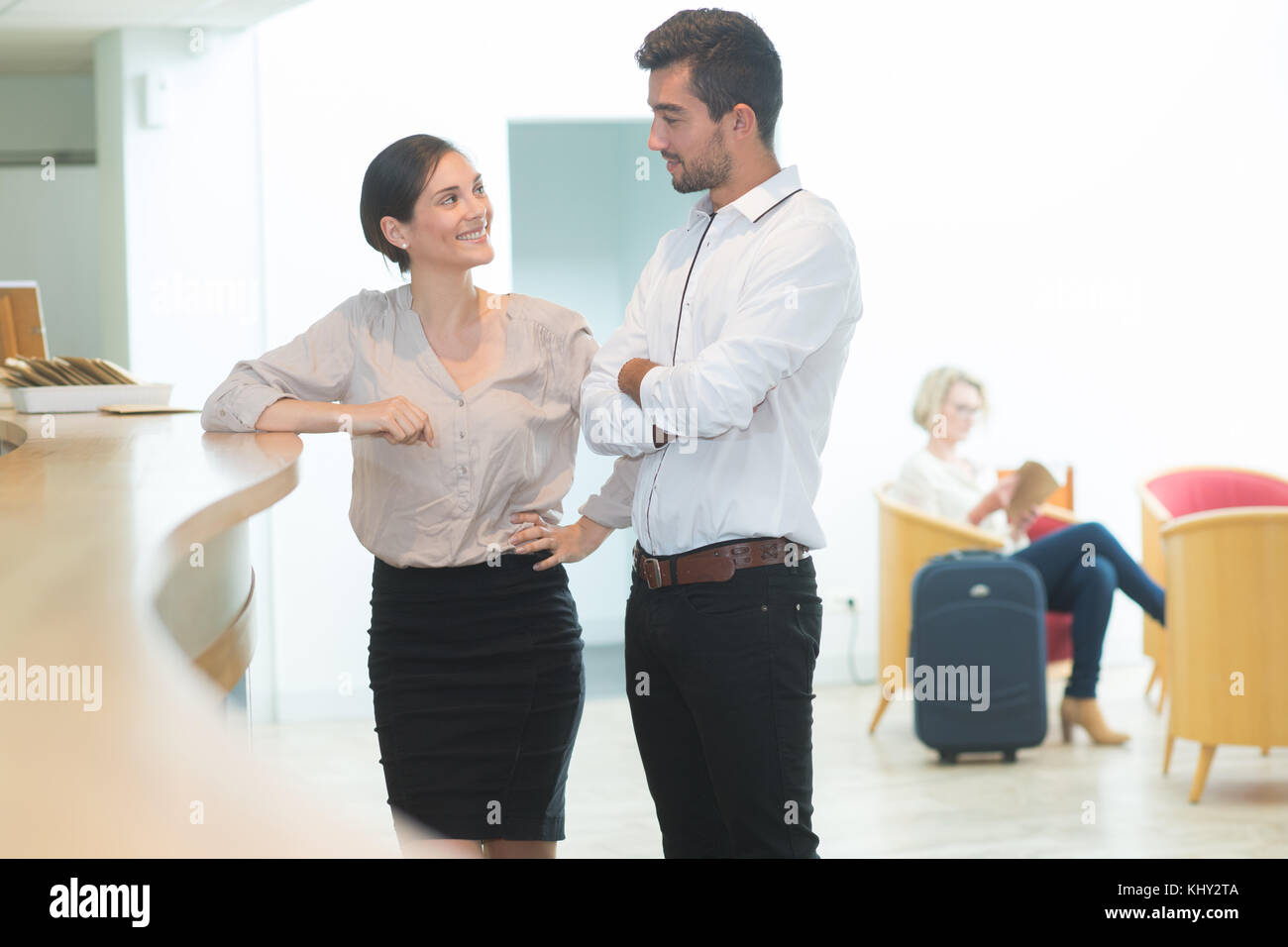couple check in at hotel reception Stock Photo - Alamy