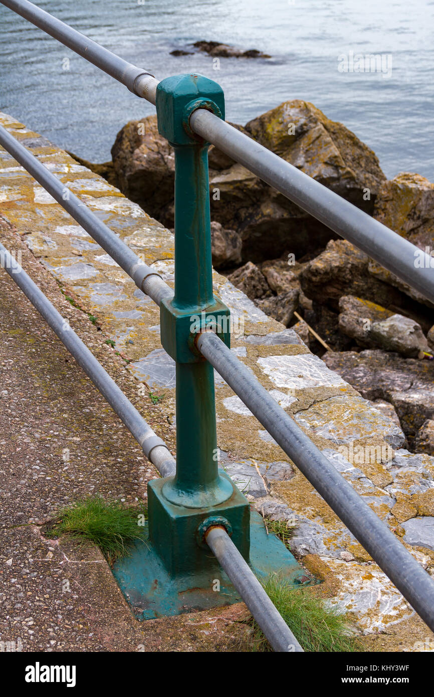 Safety Rail on the waters edge at Anstey's Cove, Torquay, Devon. England, UK Stock Photo
