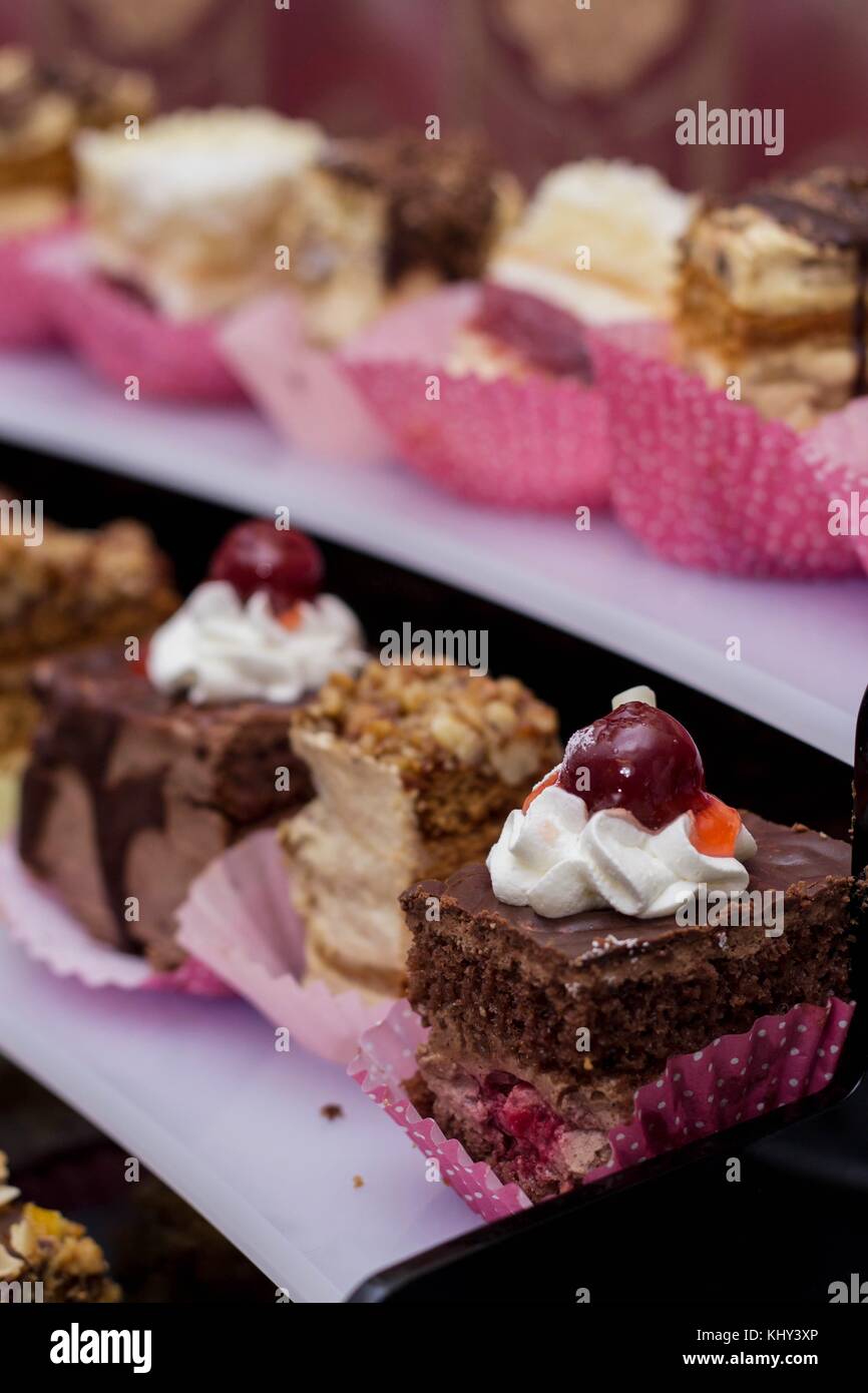 Sweet bridal buffet with cakes and muffins stacked in a pyramid