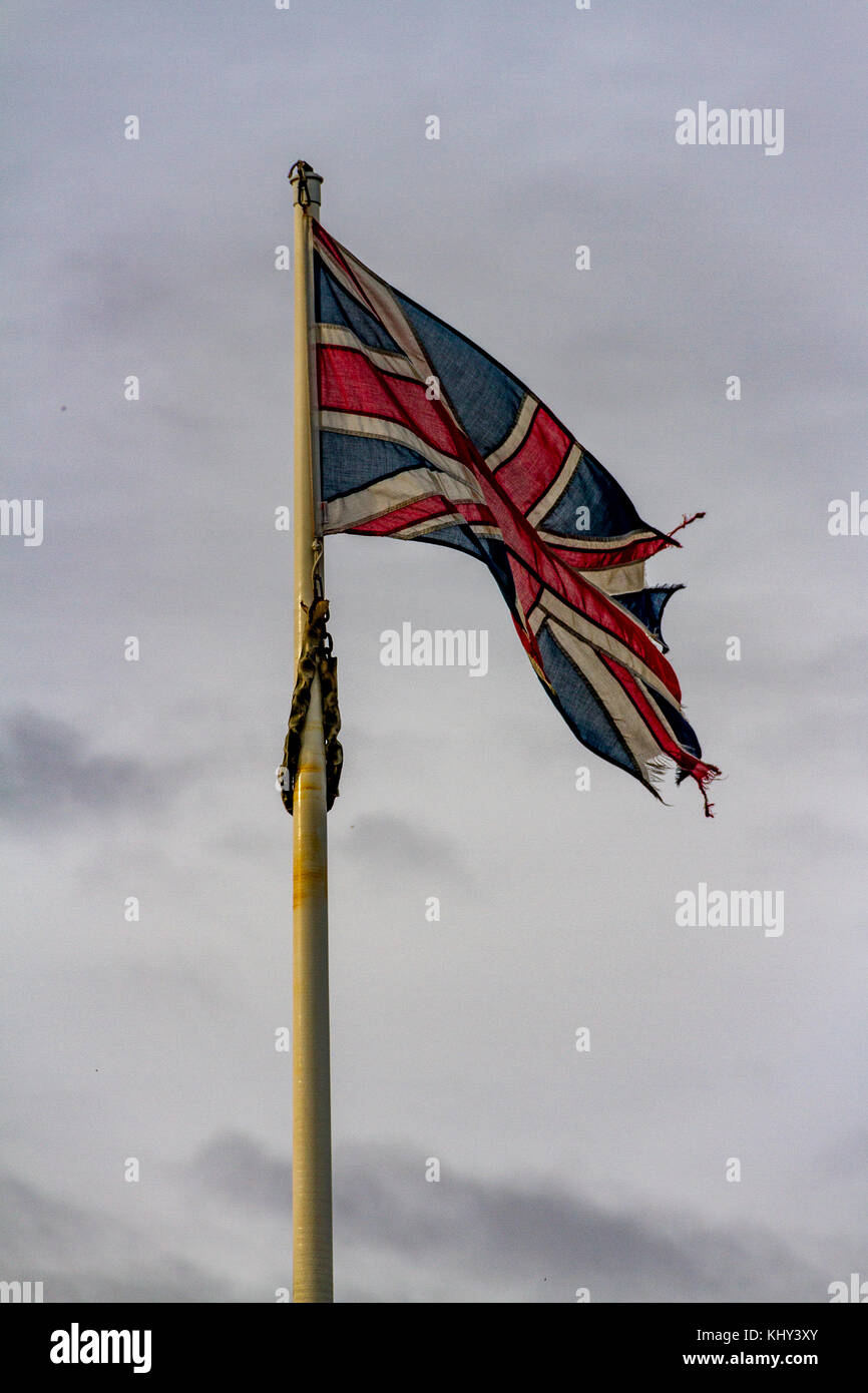 A slightly worn out Union Flag, flying in Babbacombe near Torquay, Devon, UK. Stock Photo