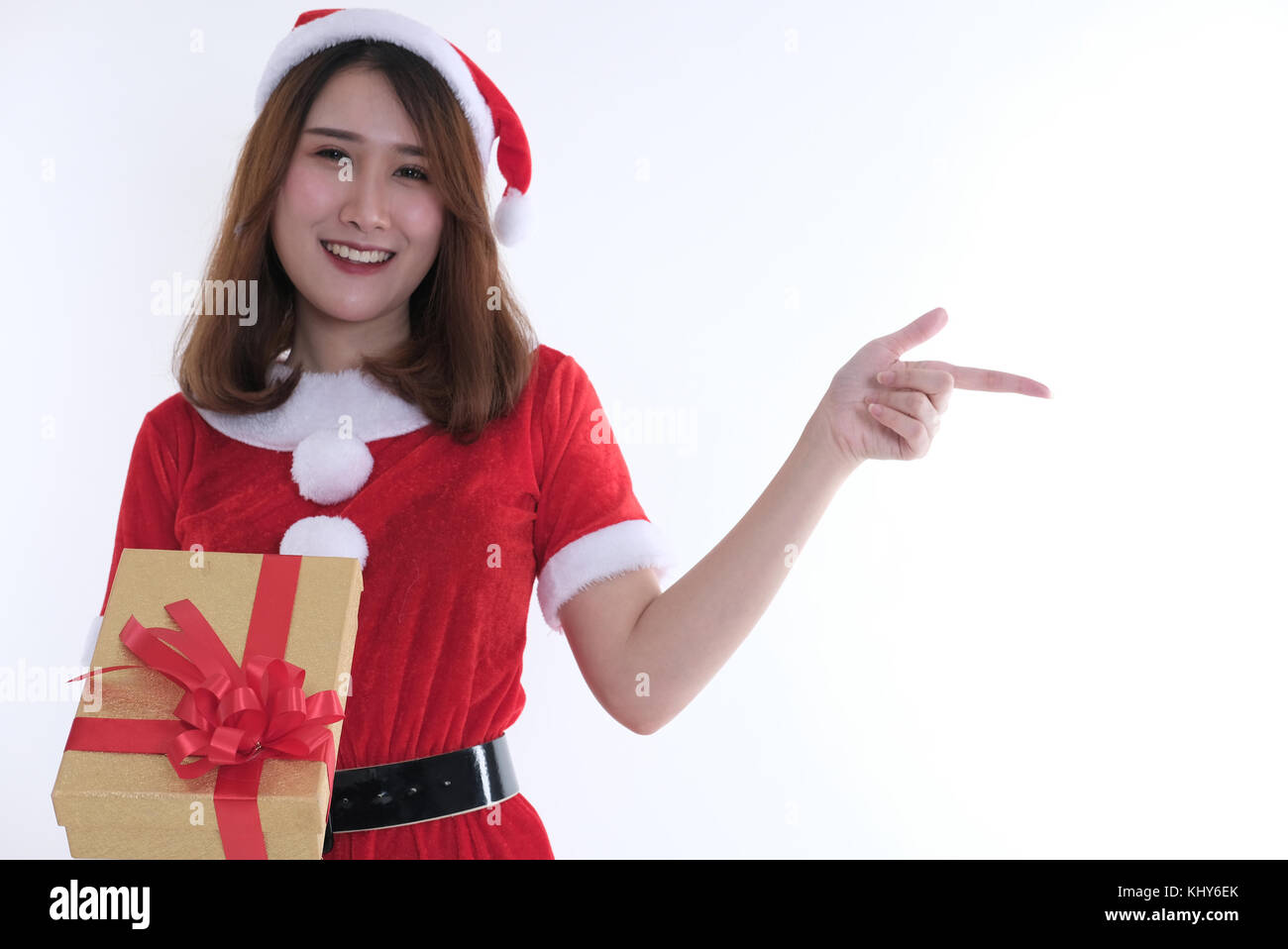 portrait of asian woman in santa claus dress on white background. girl ...