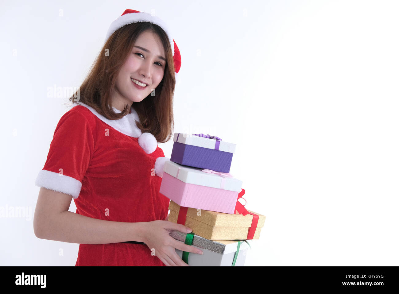 portrait of asian woman in santa claus dress on white background. girl ...