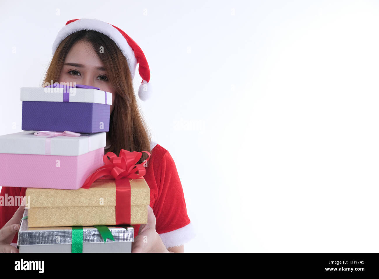 portrait of asian woman in santa claus dress on white background. girl ...
