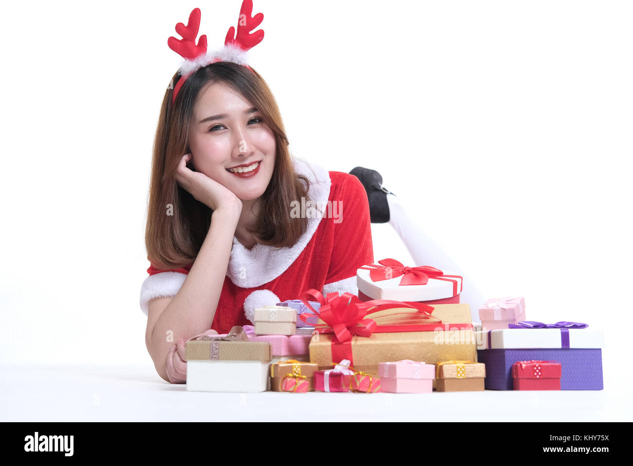 portrait of asian woman in santa claus dress on white background. girl ...