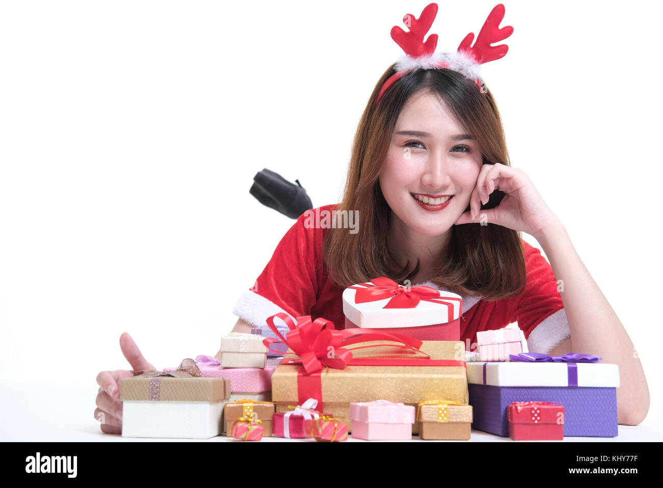 portrait of asian woman in santa claus dress on white background. girl ...