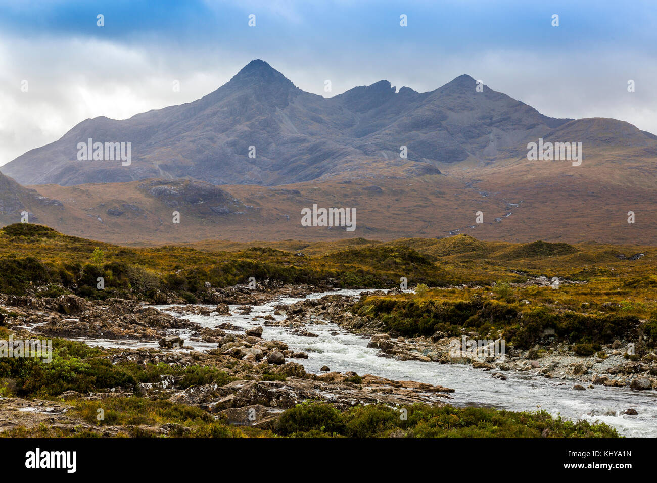 Dark clouds hang over the rugged peaks of the Black Cuillin hills and the River Sligachan on the Isle of Skye, Scotland, UK Stock Photo