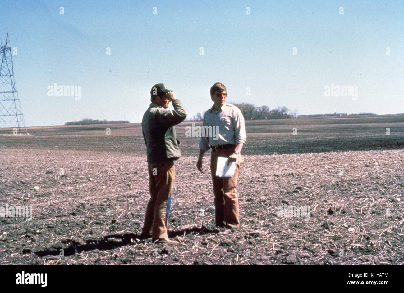 Farmers talk about farming on agricultural land Stock Photo Alamy