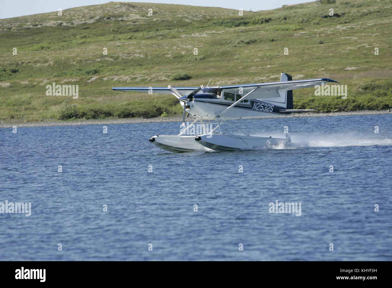 Float plane landing on lake Stock Photo - Alamy