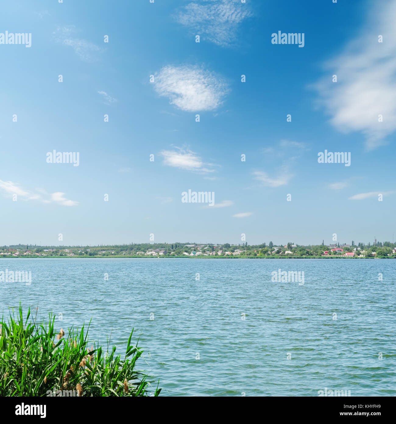 river and blue sky with clouds Stock Photo - Alamy