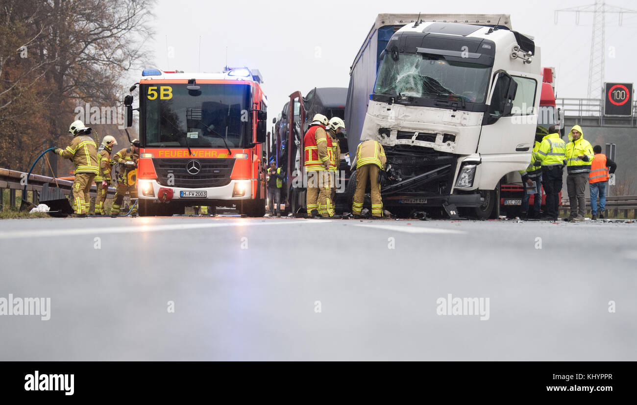 Firefighters stand on the motorway A2 after an accident at the motorway ...