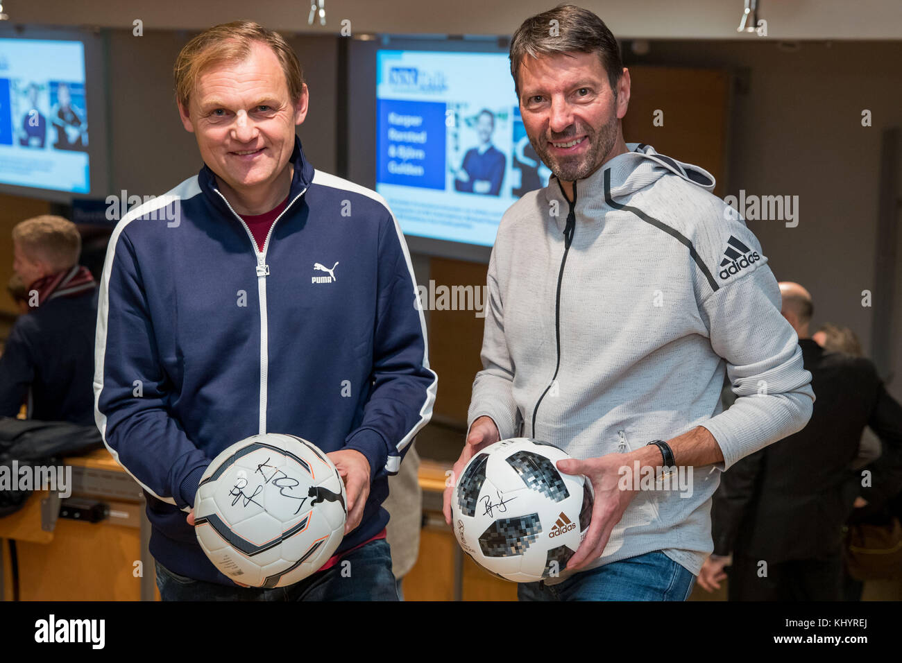 Nuremberg, Germany. 21st Nov, 2017. The CEOs of adidas, Kasper Rorsted (R), and Puma, Bjoern Gulden, stand to each other prior to a joint panel discussion of the 'Nuremberg News' in