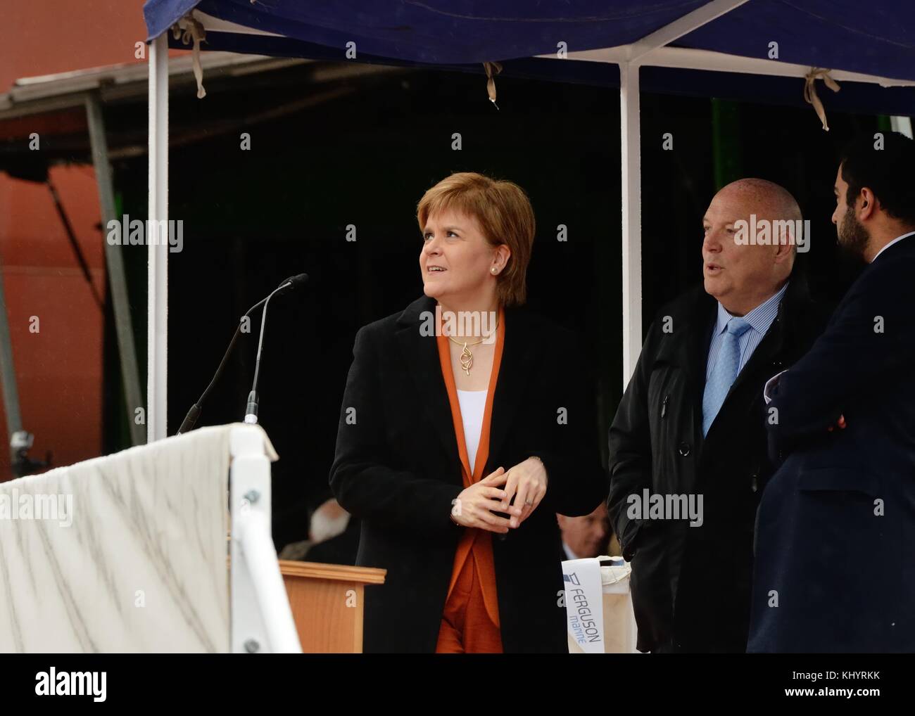 Port Glasgow, Scotland, UK. 21st Nov, 2017. First Minister, Nicola Sturgeon launches the Glen Sannox car ferry on the river Clyde at Ferguson's in Port Glasgow as Jim McCall and Humza Yousaf watch on. Stock Photo