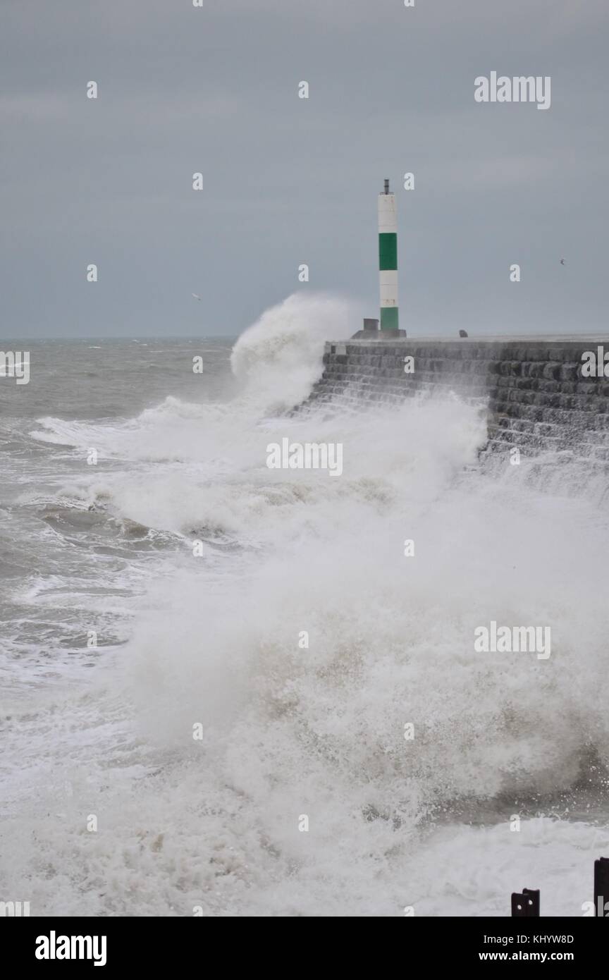 Aberystwyth Wales UK, Wednesday 22 November 2017 UK Weather: High tides and strong winds, gusting up to 50 mph, combine to bring waves crashing into the sea defences and promenade in the early morning in Aberystwyth, on the Cardigan Bay coast of west wales. The Met Office has issued a yellow warning for wind for much of England and Wales for the whole of the day, with delays to road, rail, air and ferry transport likely whilst outbreaks of rain, occasionally heavy, will add to the difficult travel conditions photo Credit: Keith Morris/Alamy Live News Stock Photo