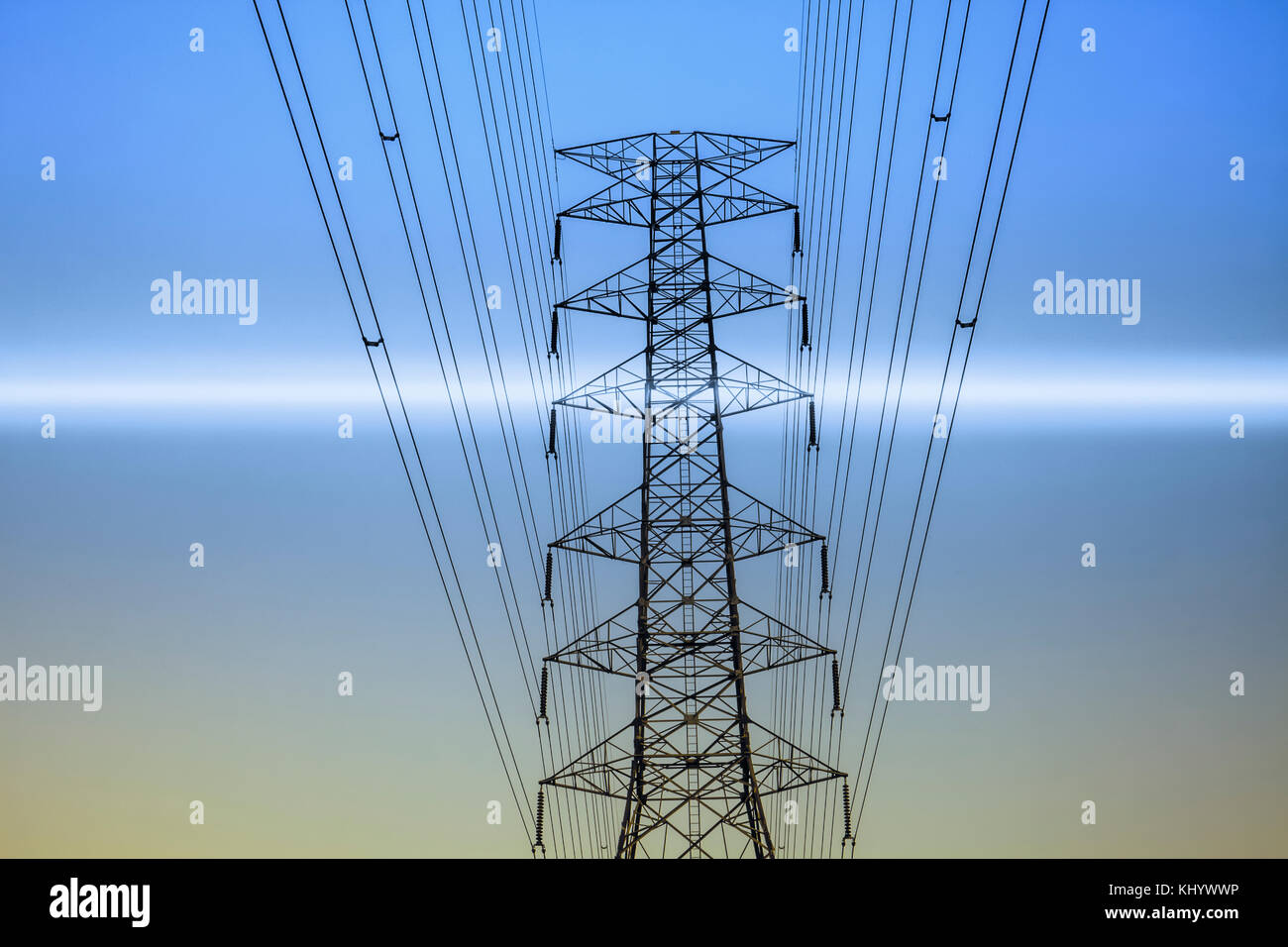 High voltage power pylon in blue background Stock Photo - Alamy