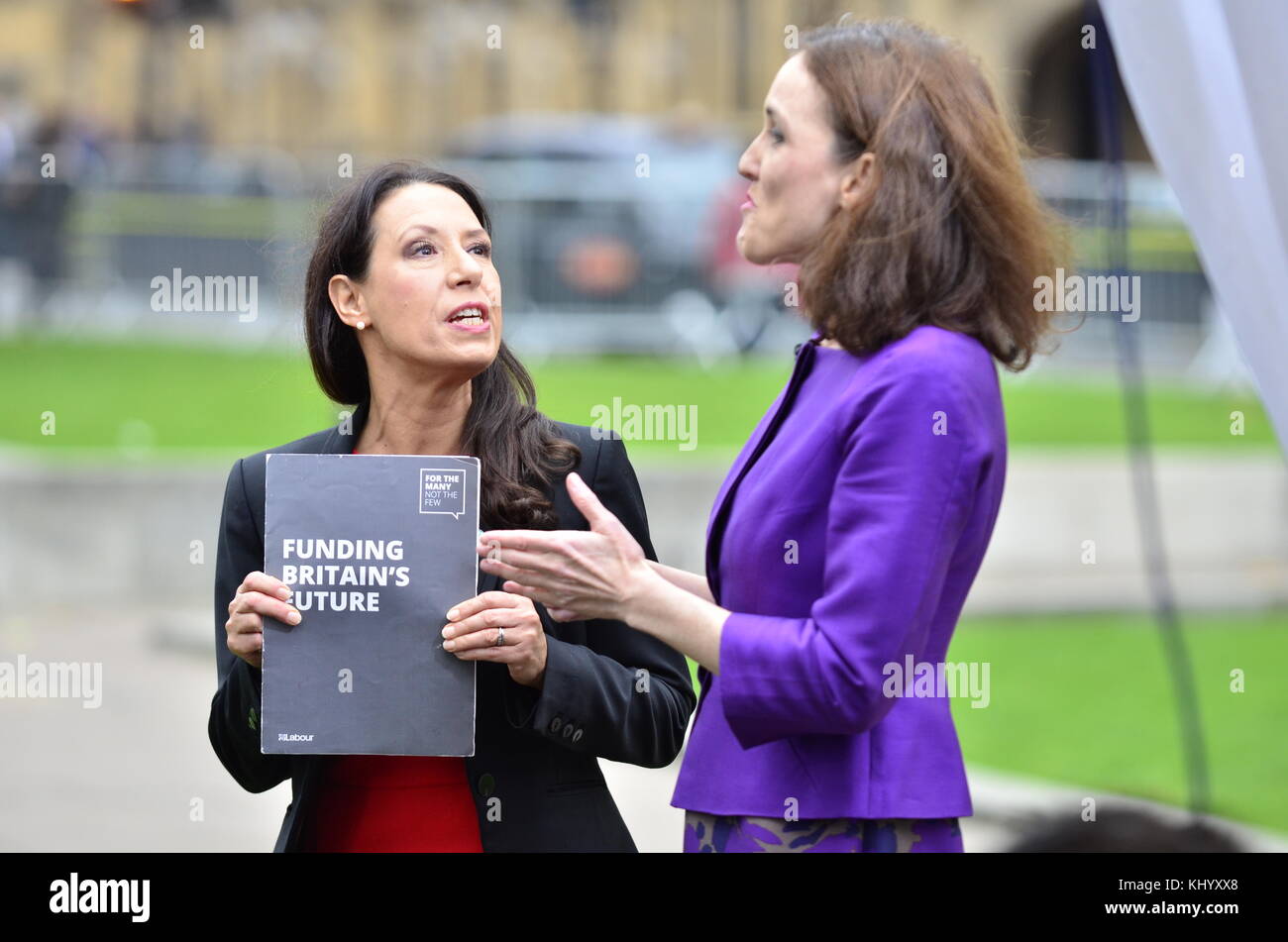 London, UK. 22nd November. Debbie Abrahams MP (Labour; Oldham East and Saddleworth) and Theresa Villiers MP (Con) engage in a lively BBC TV interview on College Green, Westminster shortly before Philip Hammond begins his budget speech in the house. Credit: PjrNews/Alamy Live News Stock Photo
