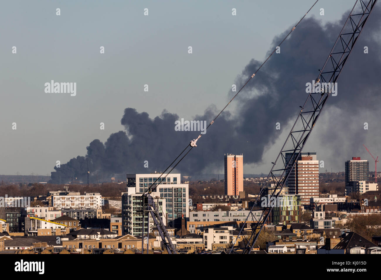 London, UK. 23th Nov, 2017. Black smoke rises from a warehouse fire in Ponders End, Enfield. Seen from south east London. Currently 12 fire engines and 81 firefighters are tackling the blaze. Credit: Guy Corbishley/Alamy Live News Stock Photo