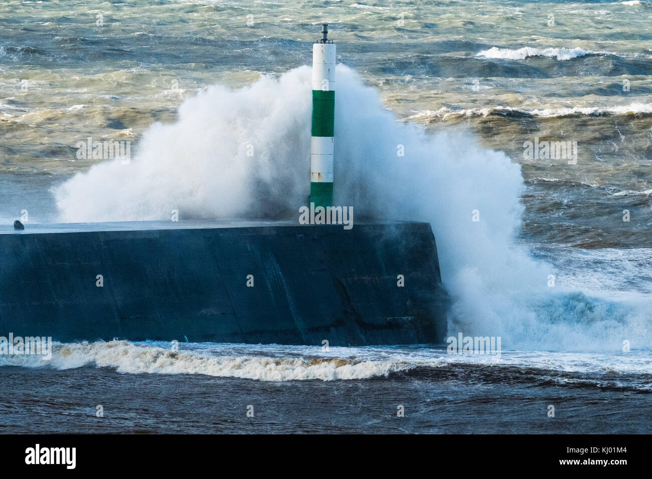 Aberystwyth Wales UK, Thursday 23 November 2017 UK Weather: High tides and very strong winds combine to bring waves crashing into the sea defences and promenade in Aberystwyth, on the Cardigan Bay coast of west wales. photo Credit: Keith Morris/Alamy Live News Stock Photo