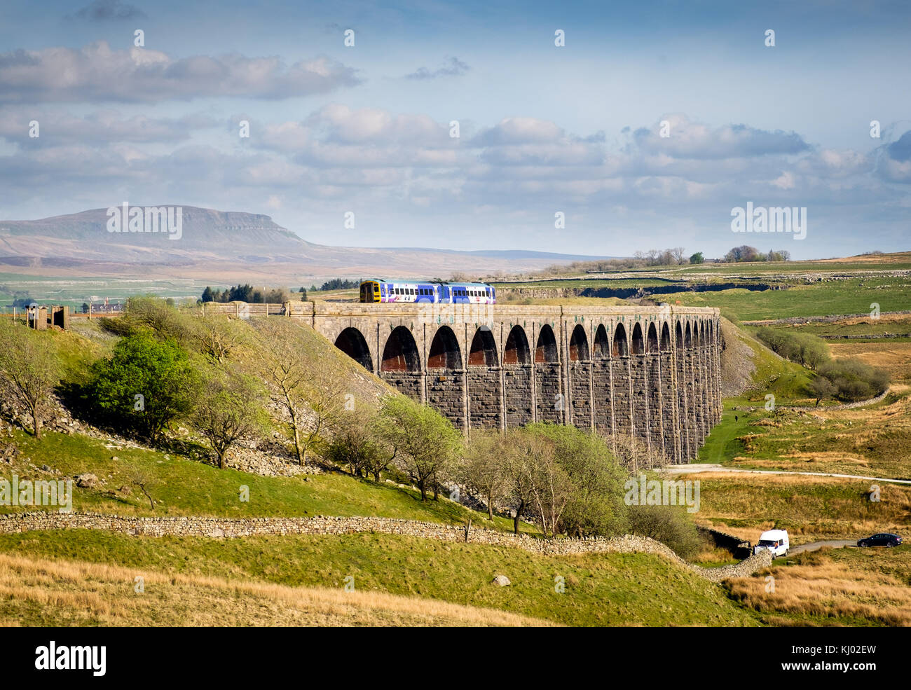 Northern Rail passenger train, crossing Ribblehead Viaduct on the Settle Carlisle line in the Yorkshire dales, England, UK Stock Photo