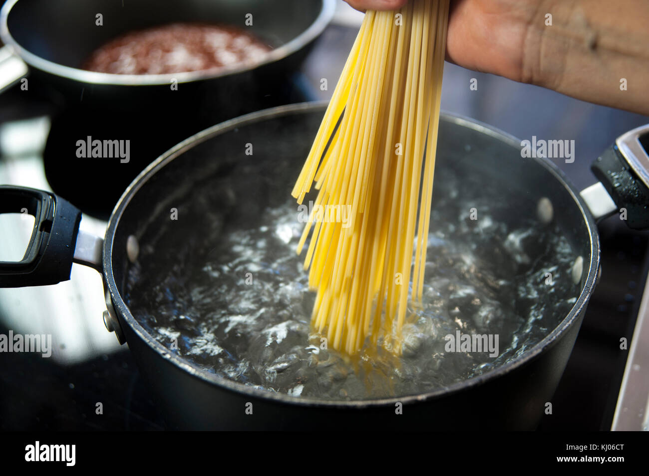 Cooking spaghetti in a pot with boiling water Stock Photo Alamy