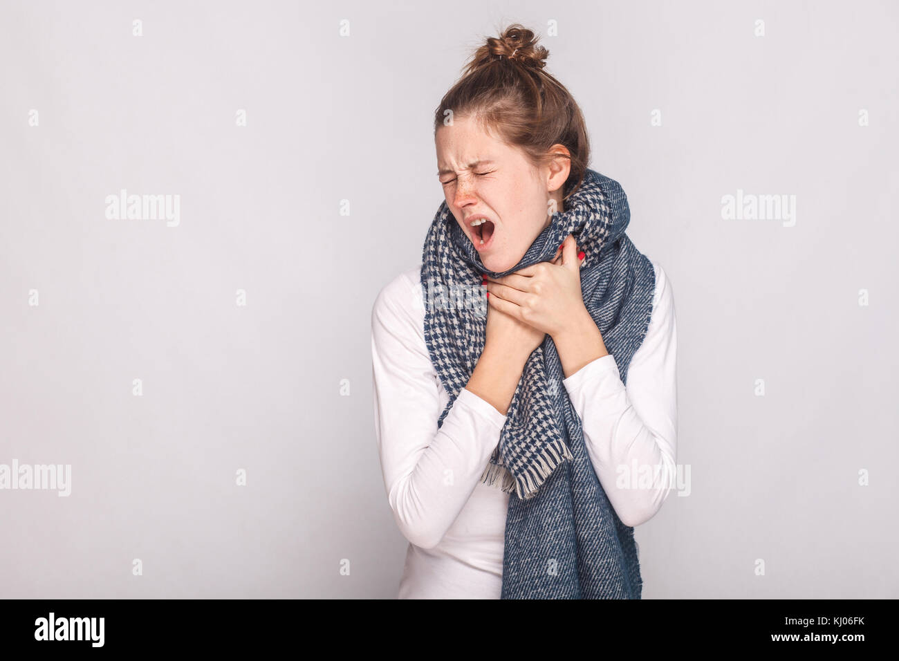 Young adult sick woman touching her neck, have cough, sore throat
