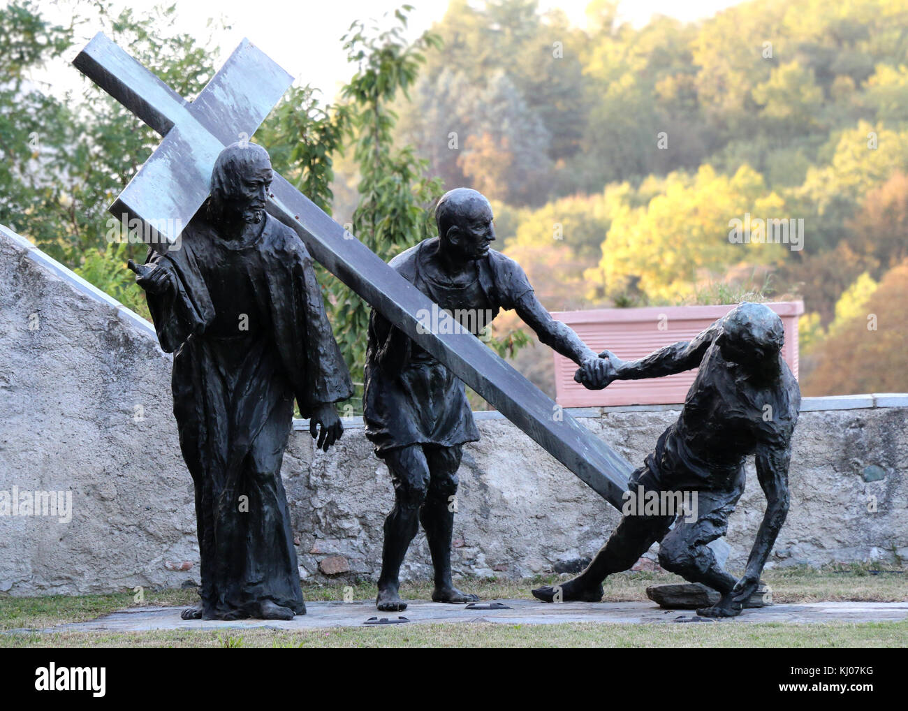 Statue of Christ and the cross in the church grounds at Avigliana, Piedmonts Stock Photo