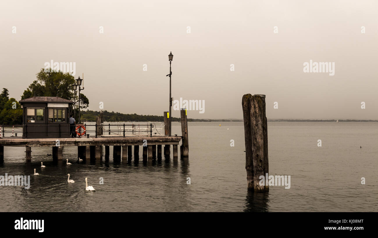 Low saturation Small wooden pier in Lasize, Italy. Stock Photo
