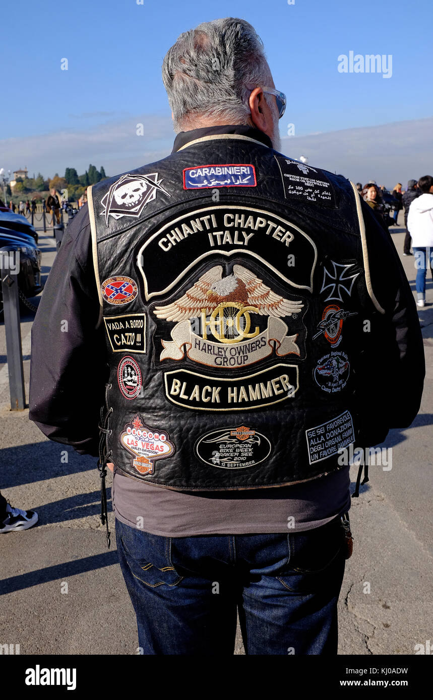 mature male wearing motorcycle gang jacket, florence, italy Stock Photo
