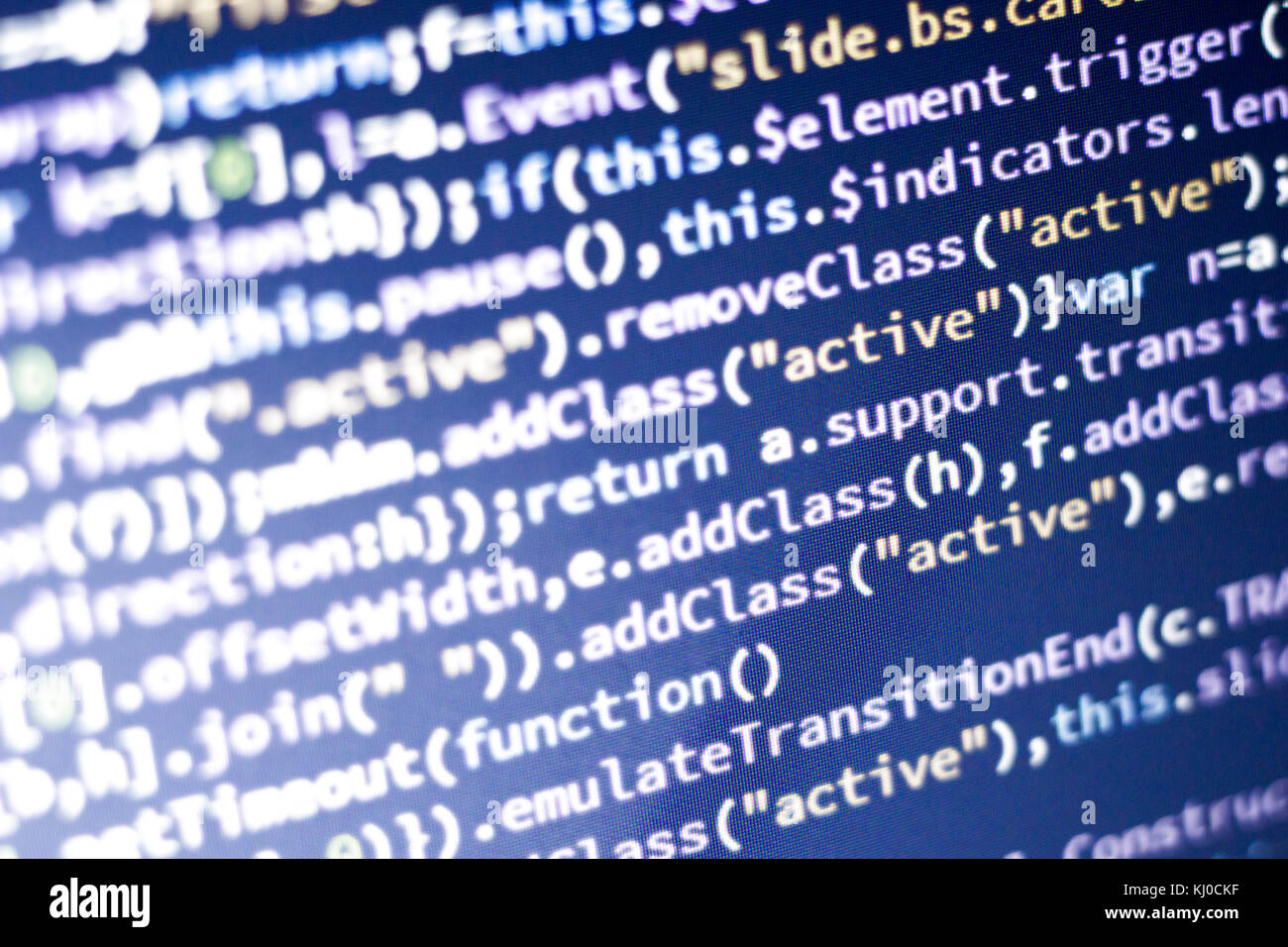 Glowing minificated javascript code. Abstract screen of modern web developer. Hacking computer network. Stock Photo